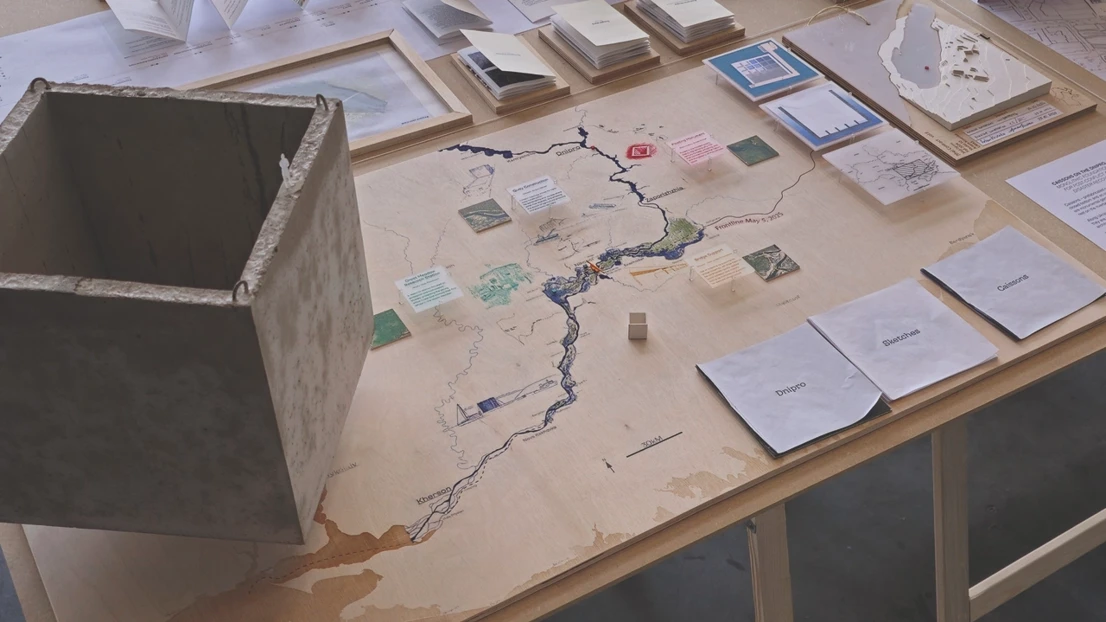 Project exhibited. Cube in concrete floating in air, map, pamphletes etc. 