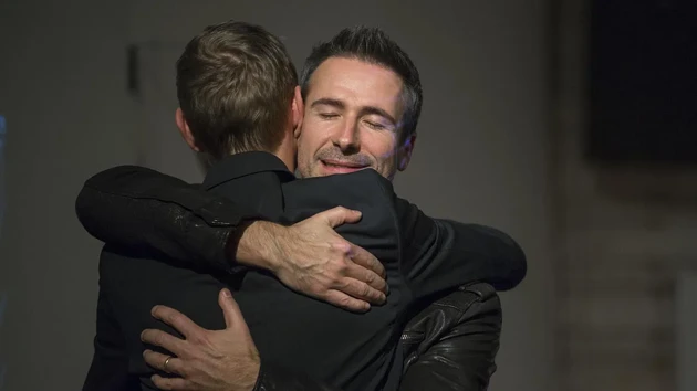 embrace between two people