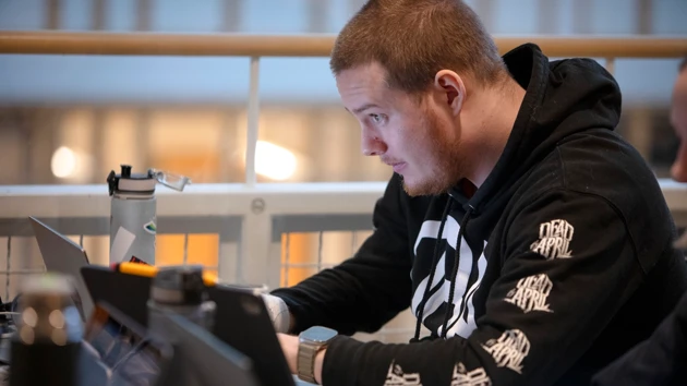 A man sitting in front of an computer